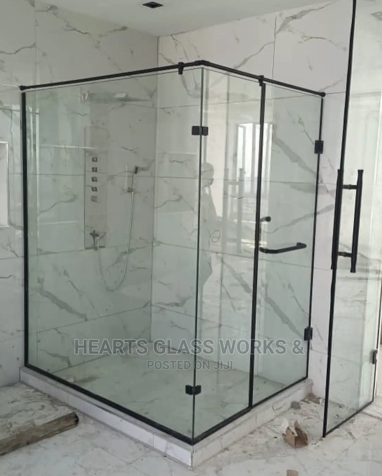 Shower Enclosure Installed With Matt Black Accessories.