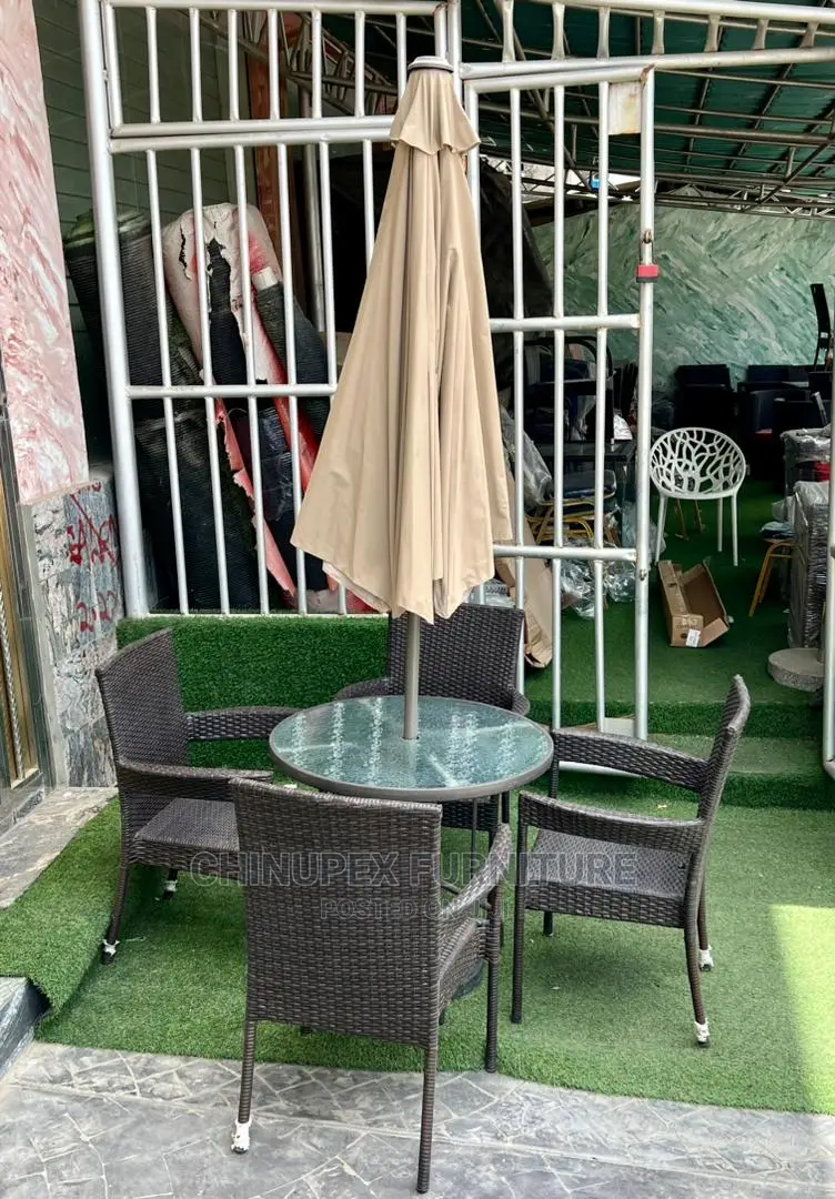 4 Seaters Rattan Chairs and Glass Table With Umbrella