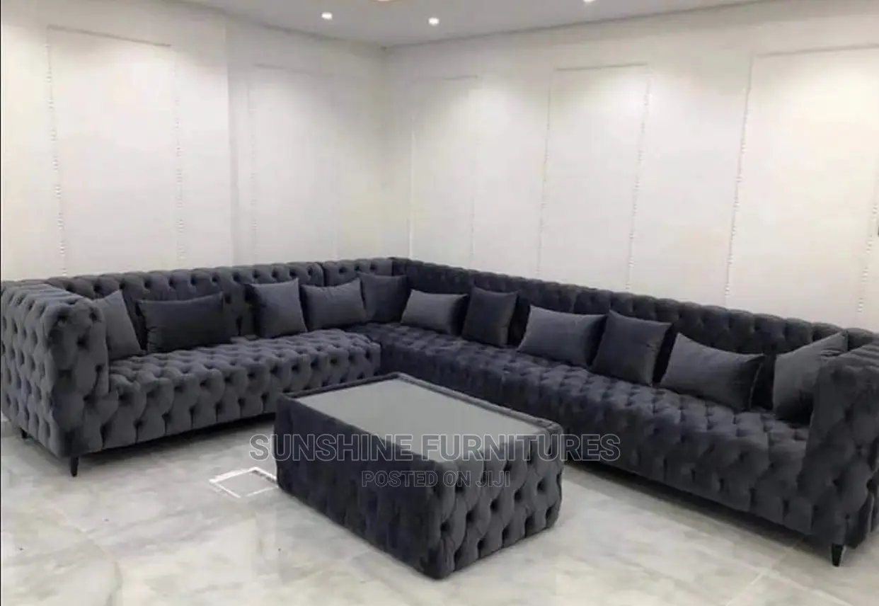 Buttoned L Shaped Sofa With Glass Top Center Table