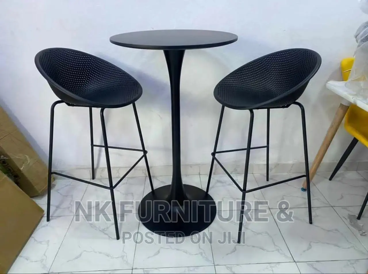 A Set of Bar Stools and Table