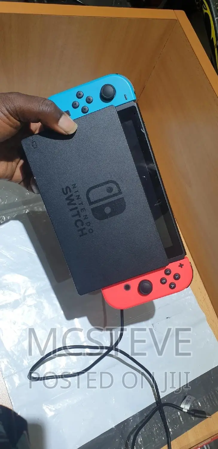 Nintendo Switch With Complete Accessories and One Free Game