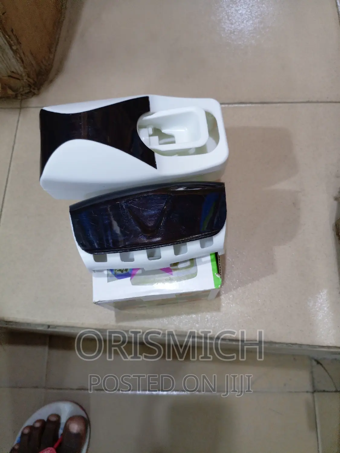 Tooth Paste Dispenser and Toothbrush Holder