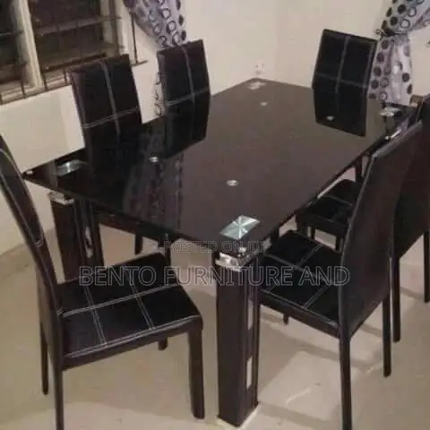 Glass Dinning Table With Six Units of Chairs
