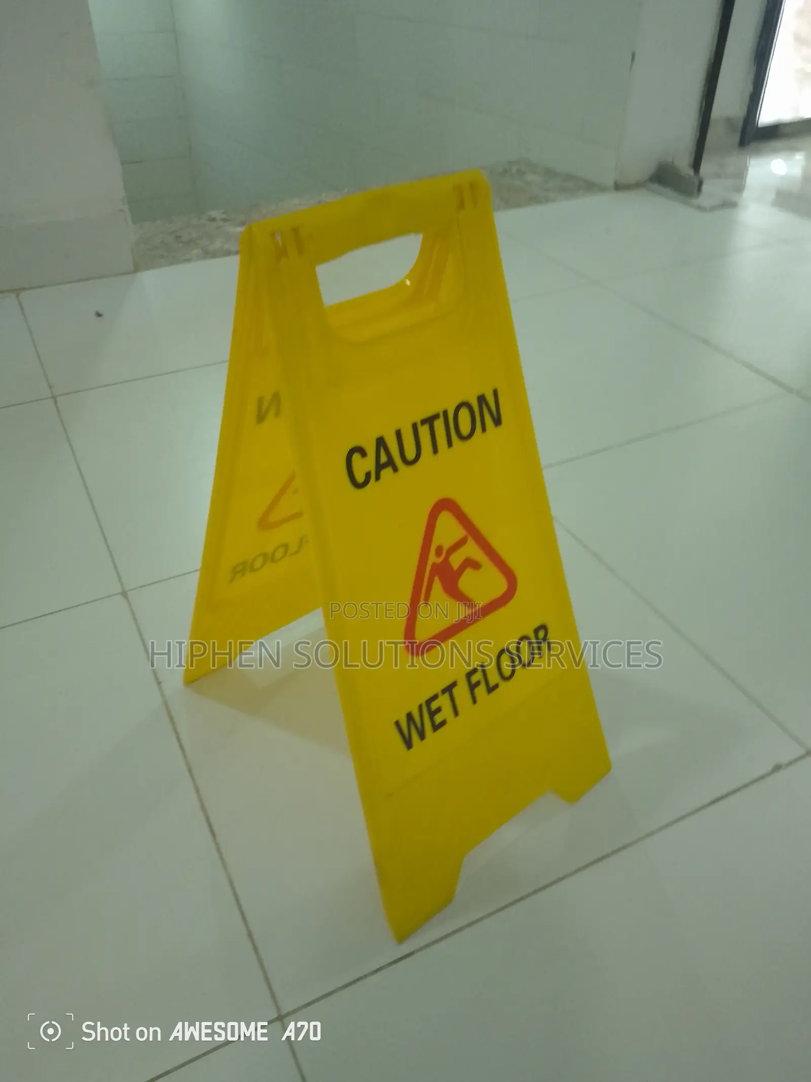 Wearing Caution Wet Floor Sign