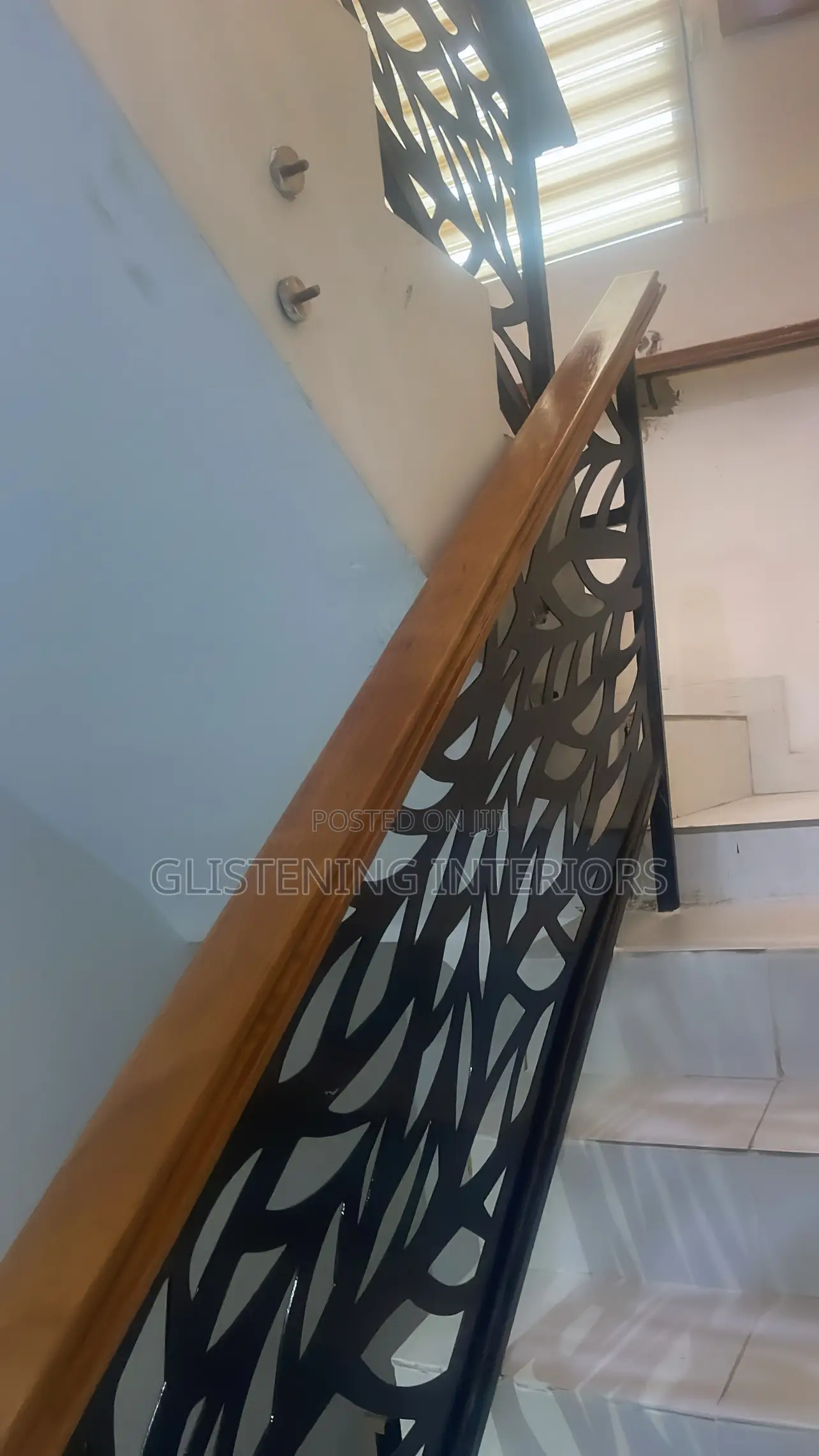 Wrought Iron Handrail With a Mahogany Wood