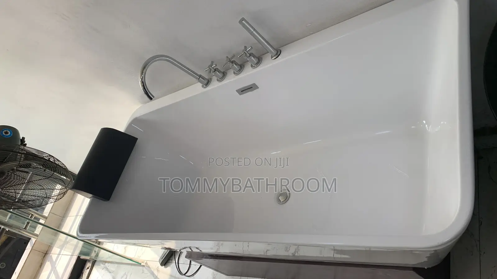 White Bathtub With Hand Shower and Tap