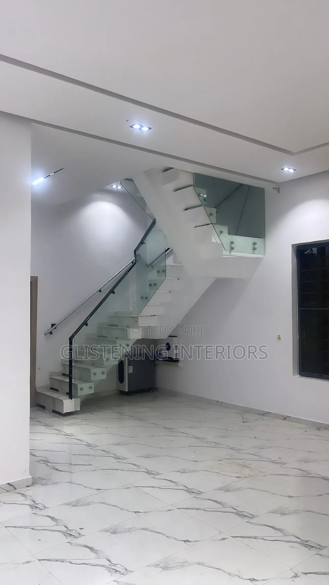Staircase Design With A Black Aluminum Handrails