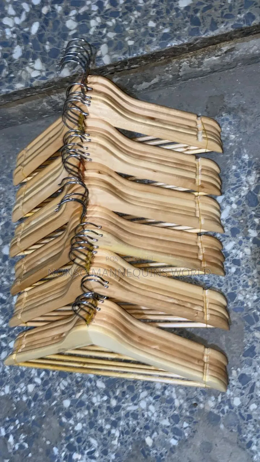 Near Packs Of Wooden Hangers For Clothing