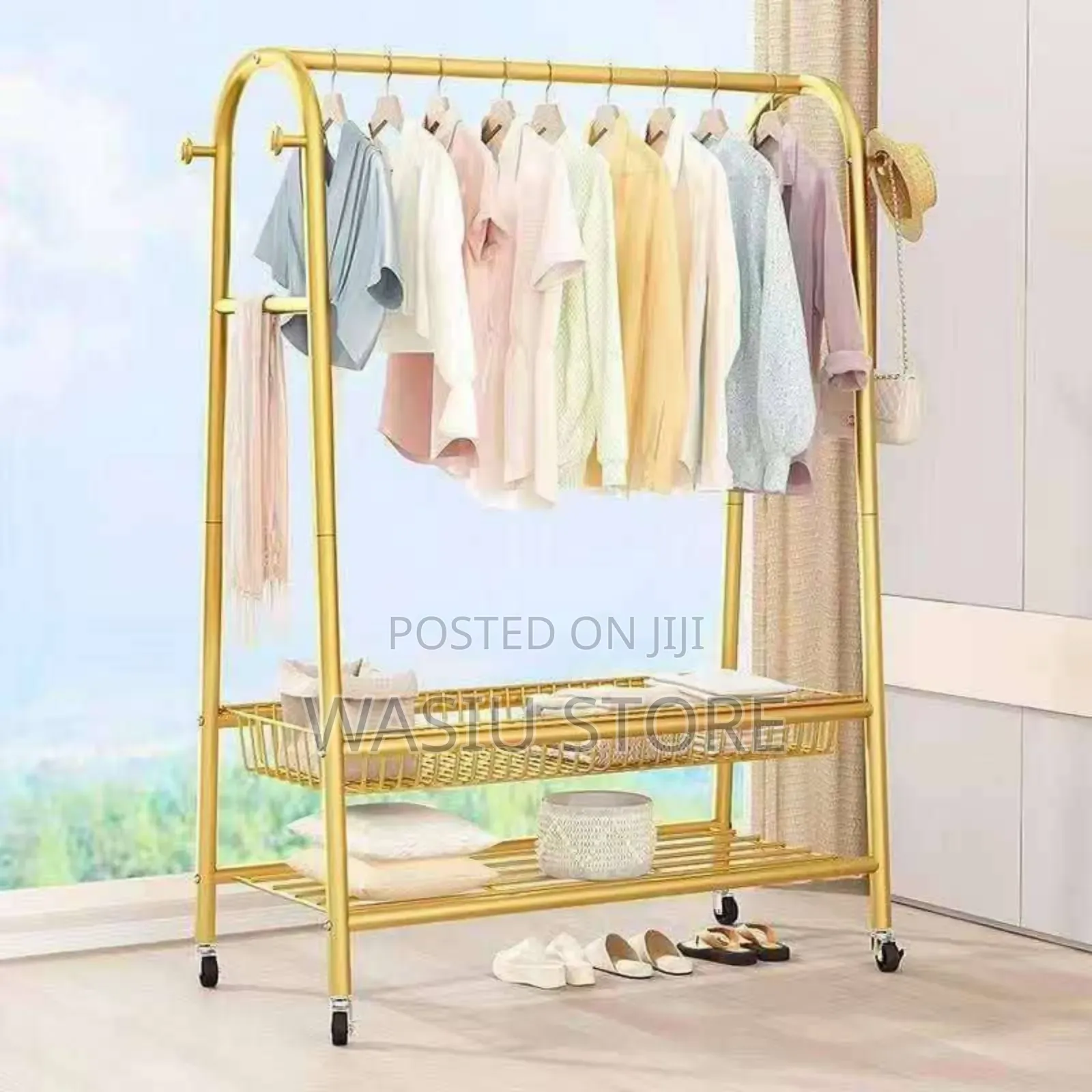 Golden Freestanding Clothes Rack With Wheels