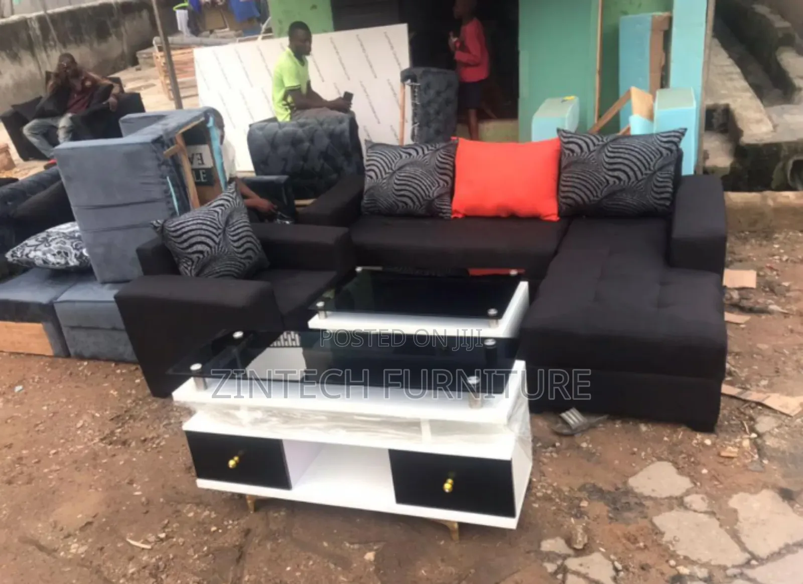 L Shape Sofas Tv Console and a Center Table
