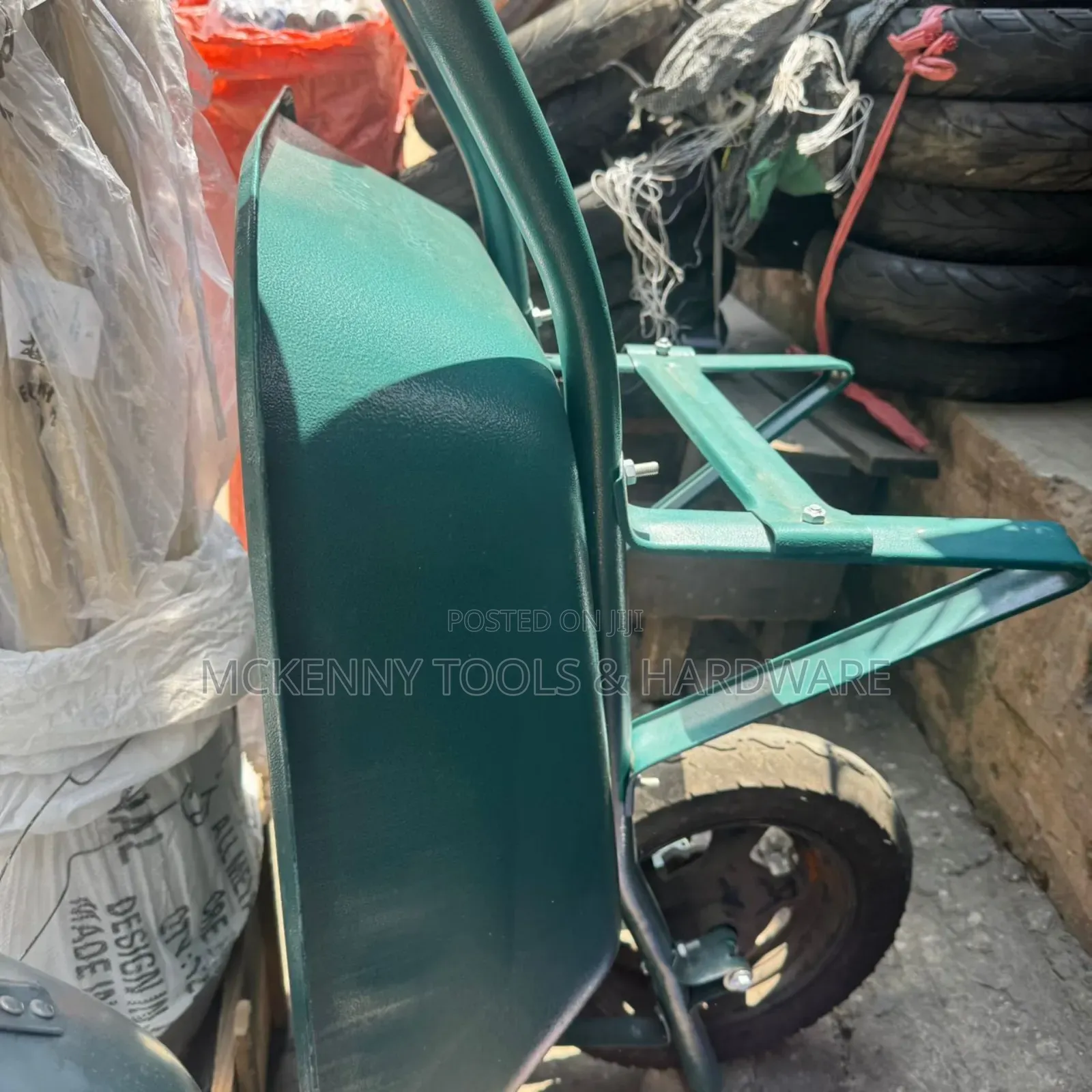 Blue Wheelbarrow, Which Is an Essential Tool for Moving Heavy Loads.