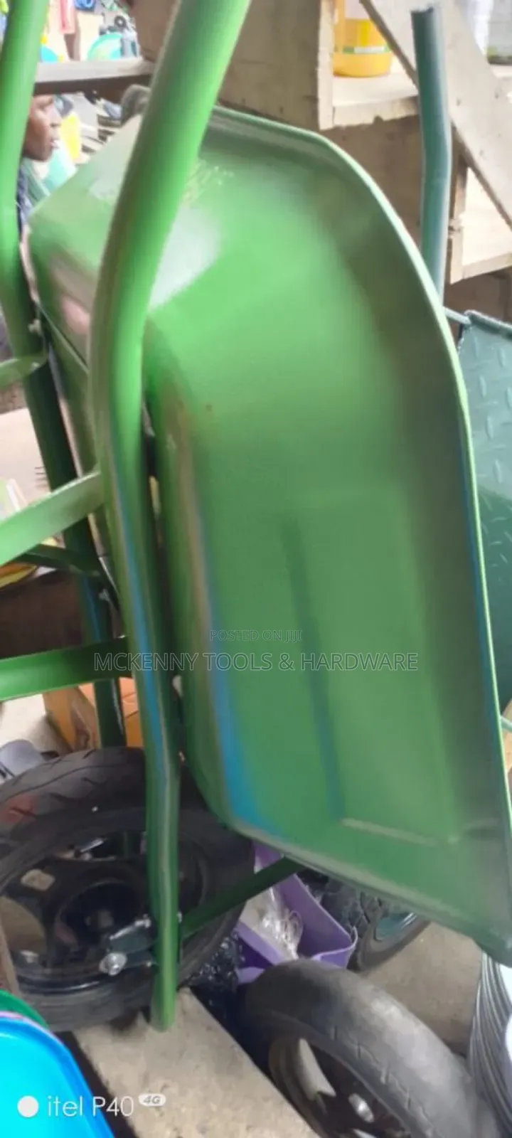 Blue Wheelbarrow, Which Is an Essential Tool for Moving Heavy Loads.