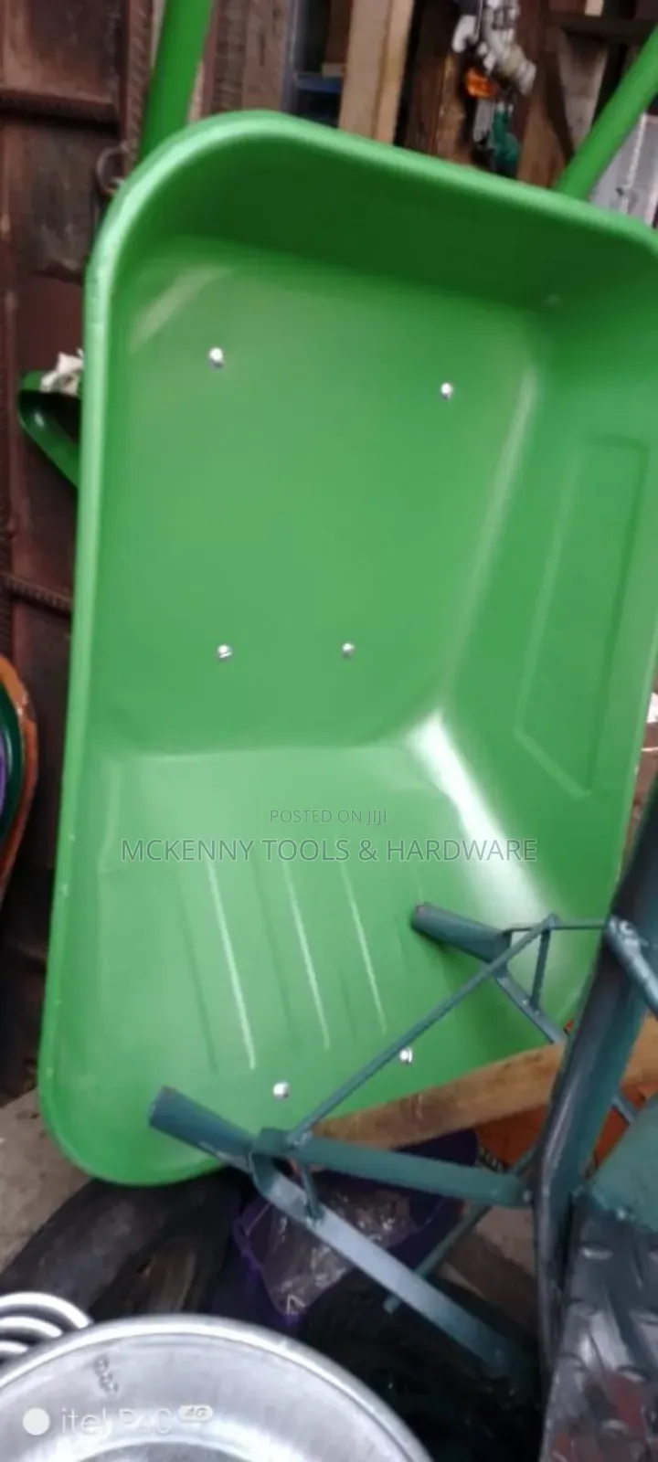Blue Wheelbarrow, Which Is an Essential Tool for Moving Heavy Loads.