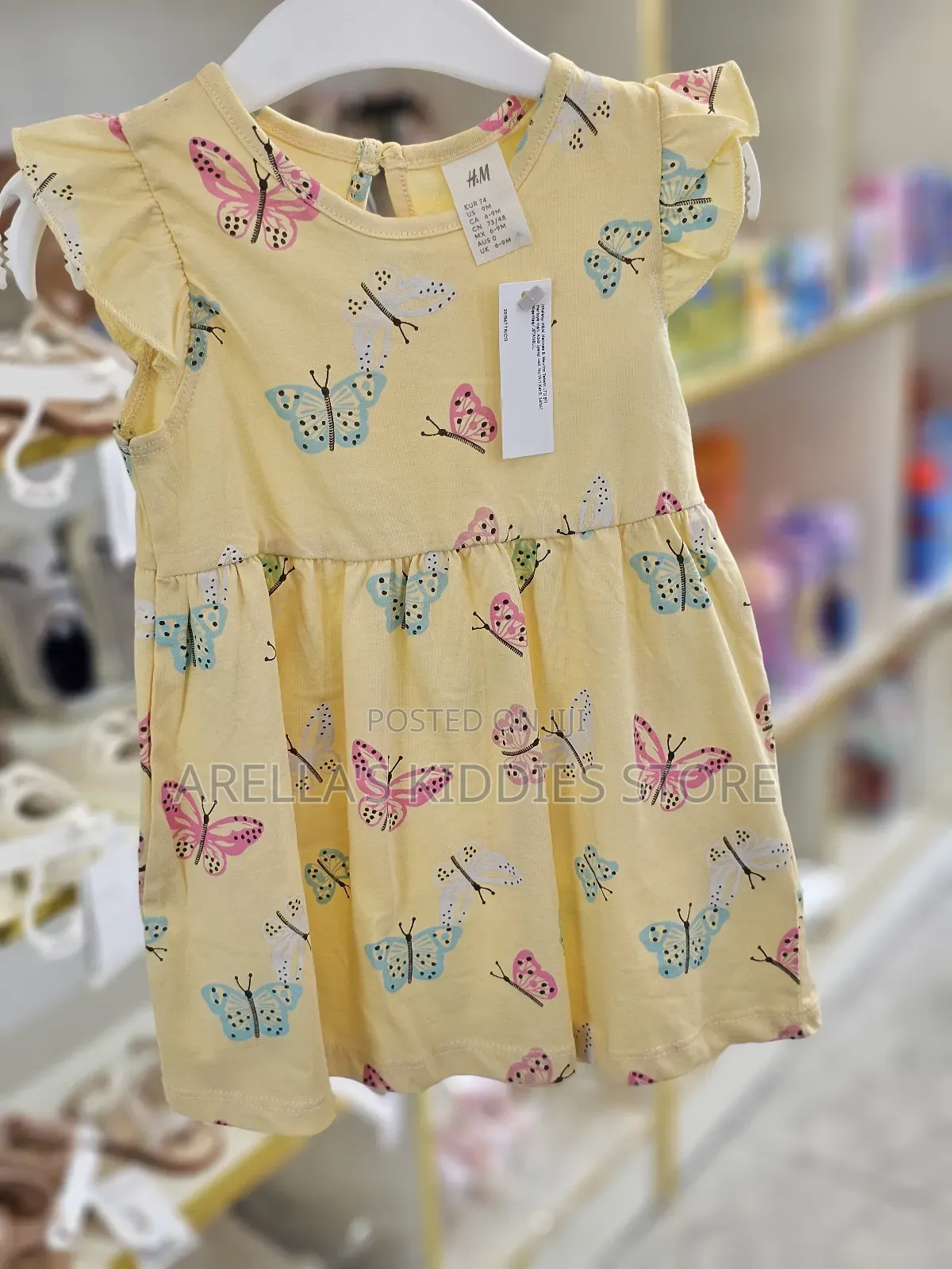 H M Printed Cotton Dress in Yellow With a Butterfly Print.