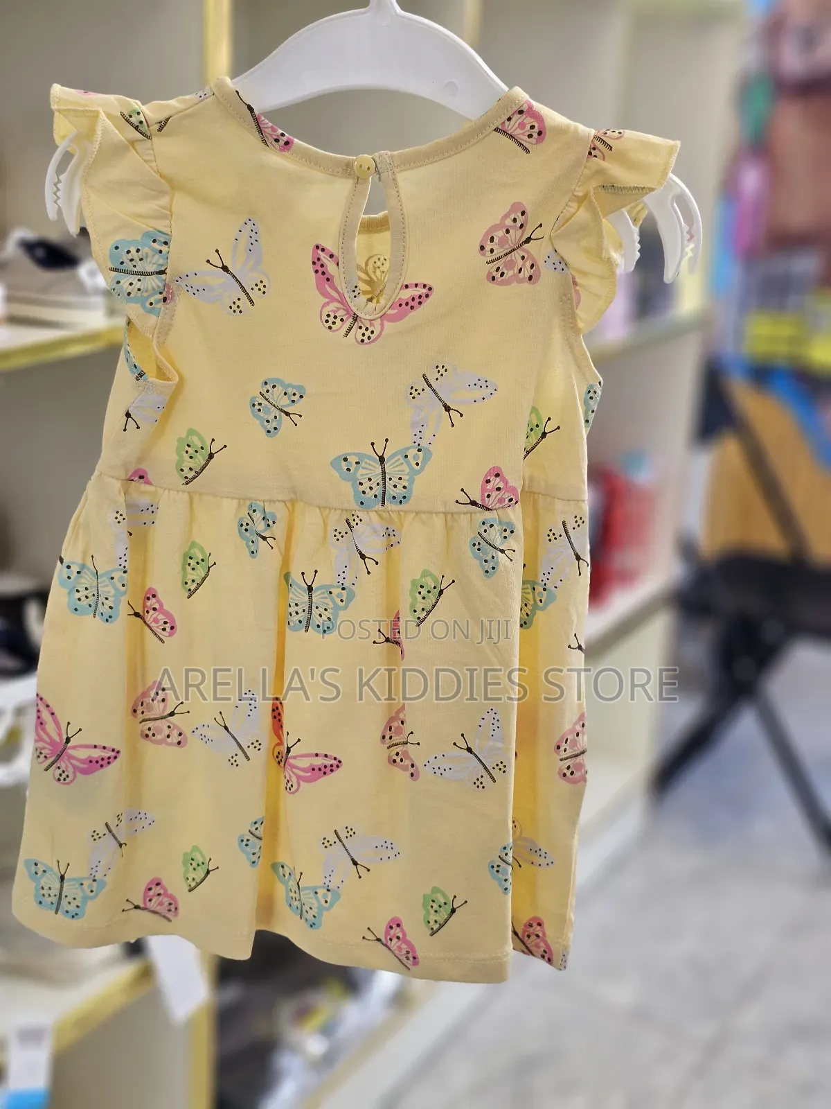 H M Printed Cotton Dress in Yellow With a Butterfly Print.