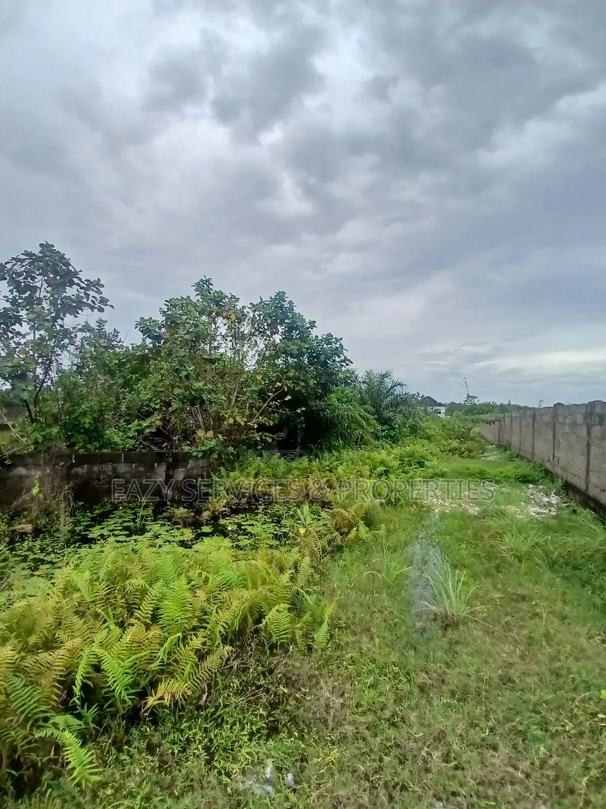 Land Measuring 1,400sqm Facing Tarred Road at Sangotedo
