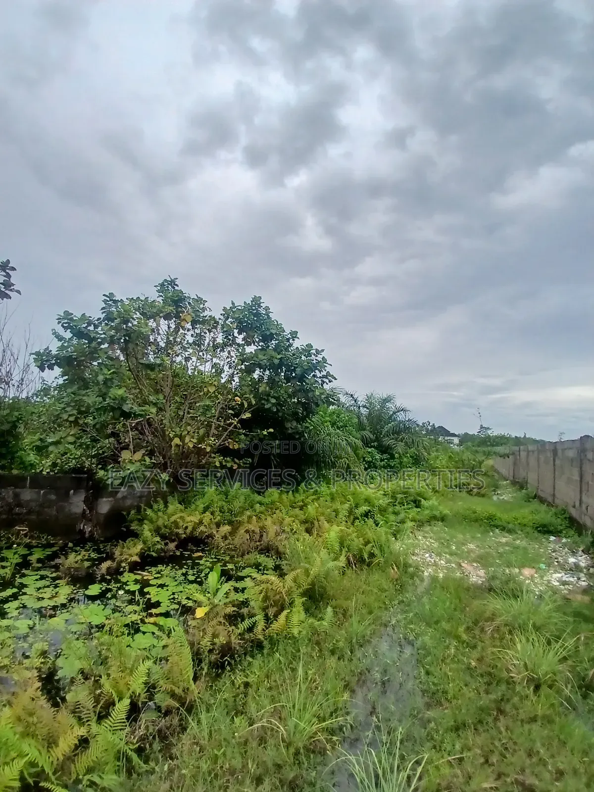 Land Measuring 1,400sqm Facing Tarred Road at Sangotedo