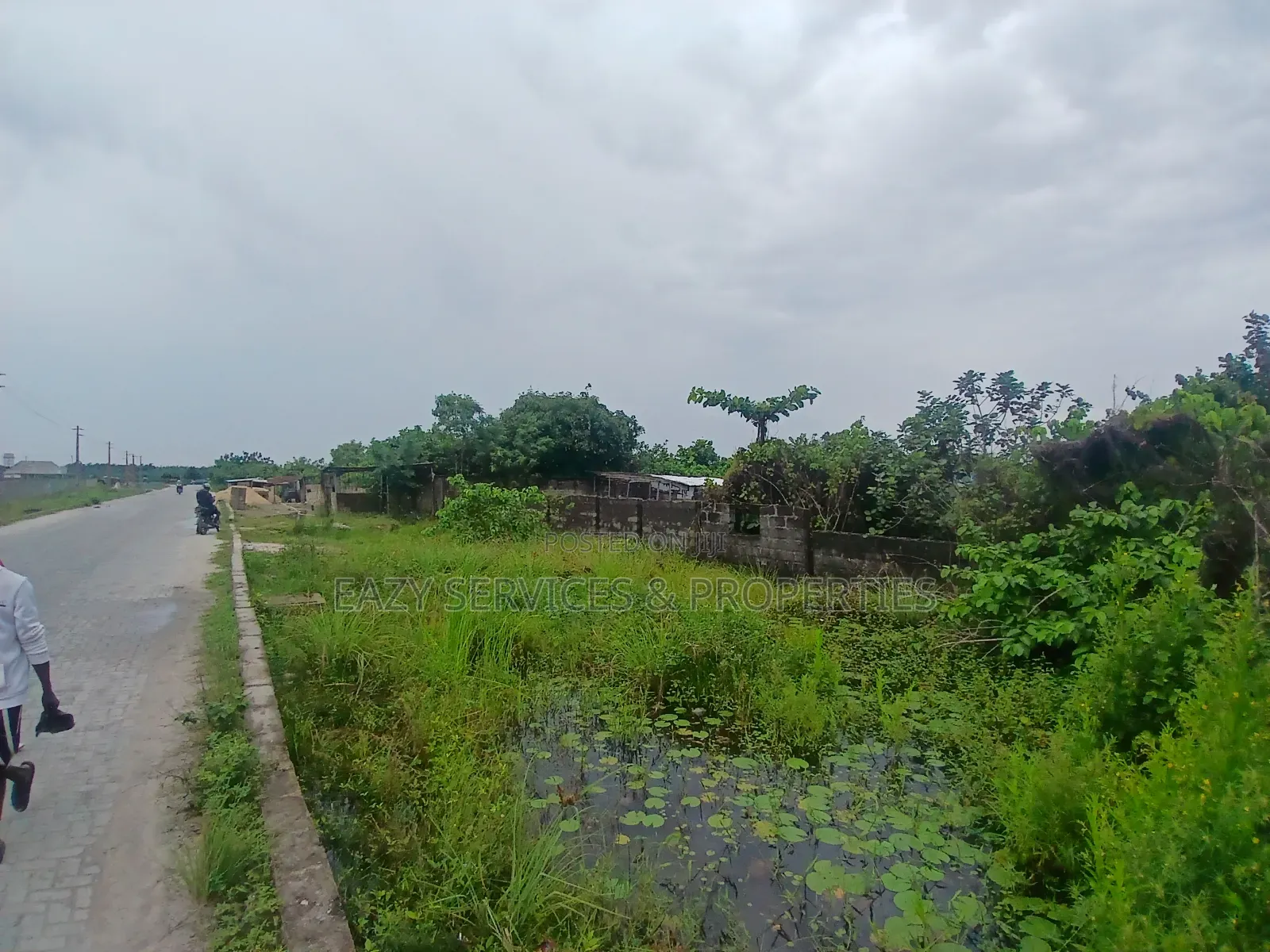 Land Measuring 1,400sqm Facing Tarred Road at Sangotedo