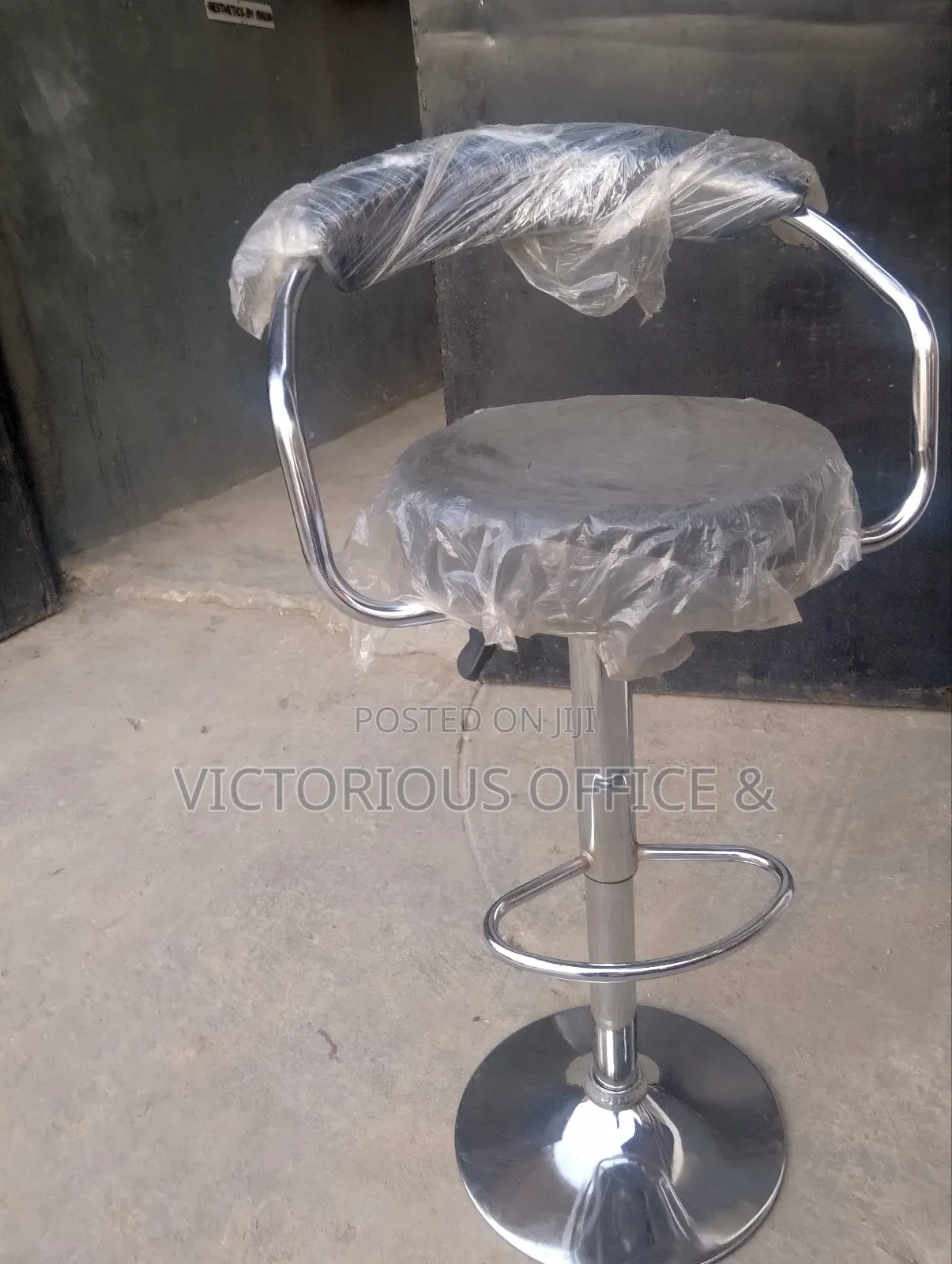 High Quality Adjustable Black Bar Stool, Chrome Base and Footrest.