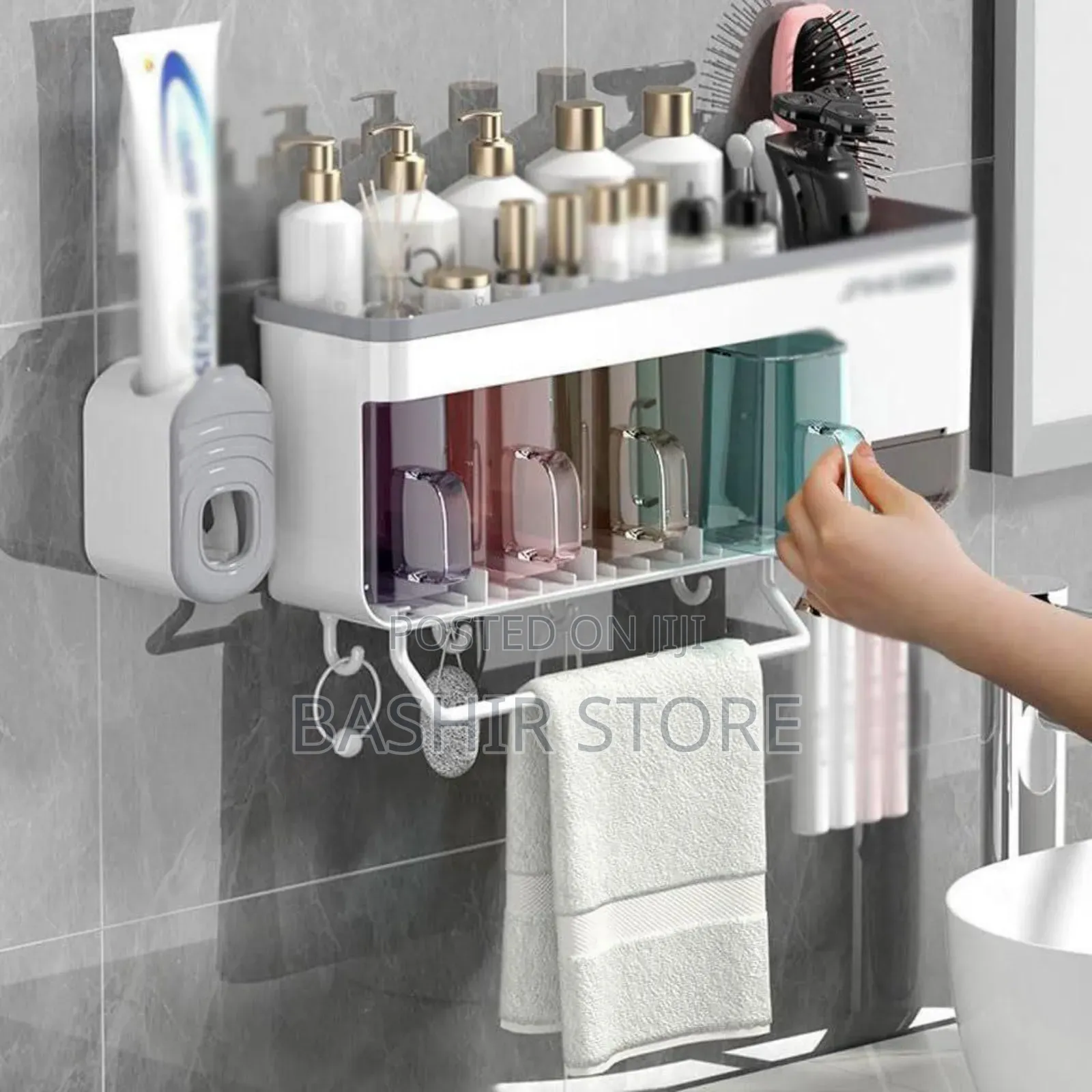 Wall-Mounted Bathroom Organizer That Includes a Toothbrush Holder