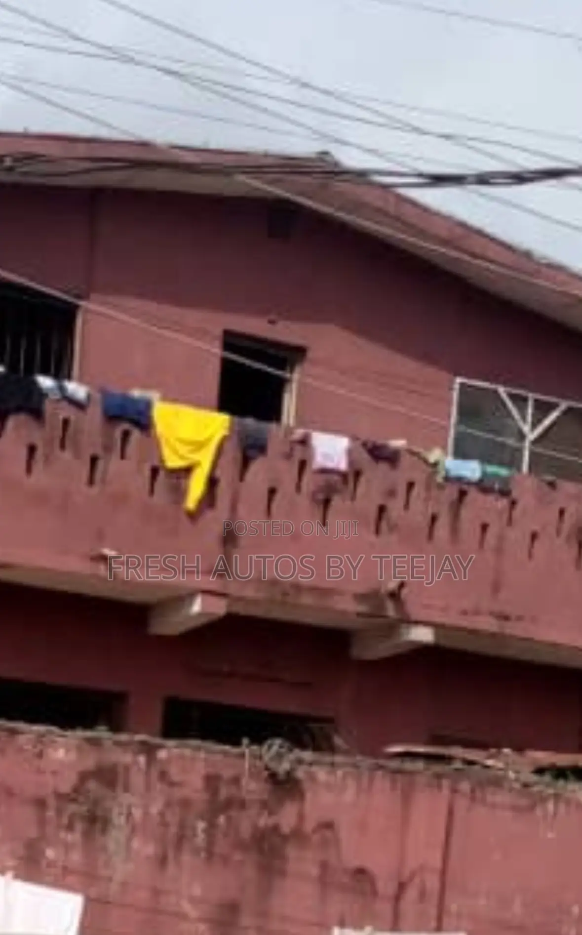 A Land With Old Storey Building in Magodo for Urgent Sale.