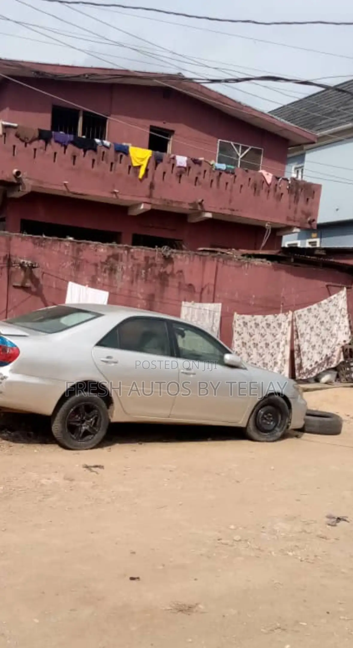 A Land With Old Storey Building in Magodo for Urgent Sale.