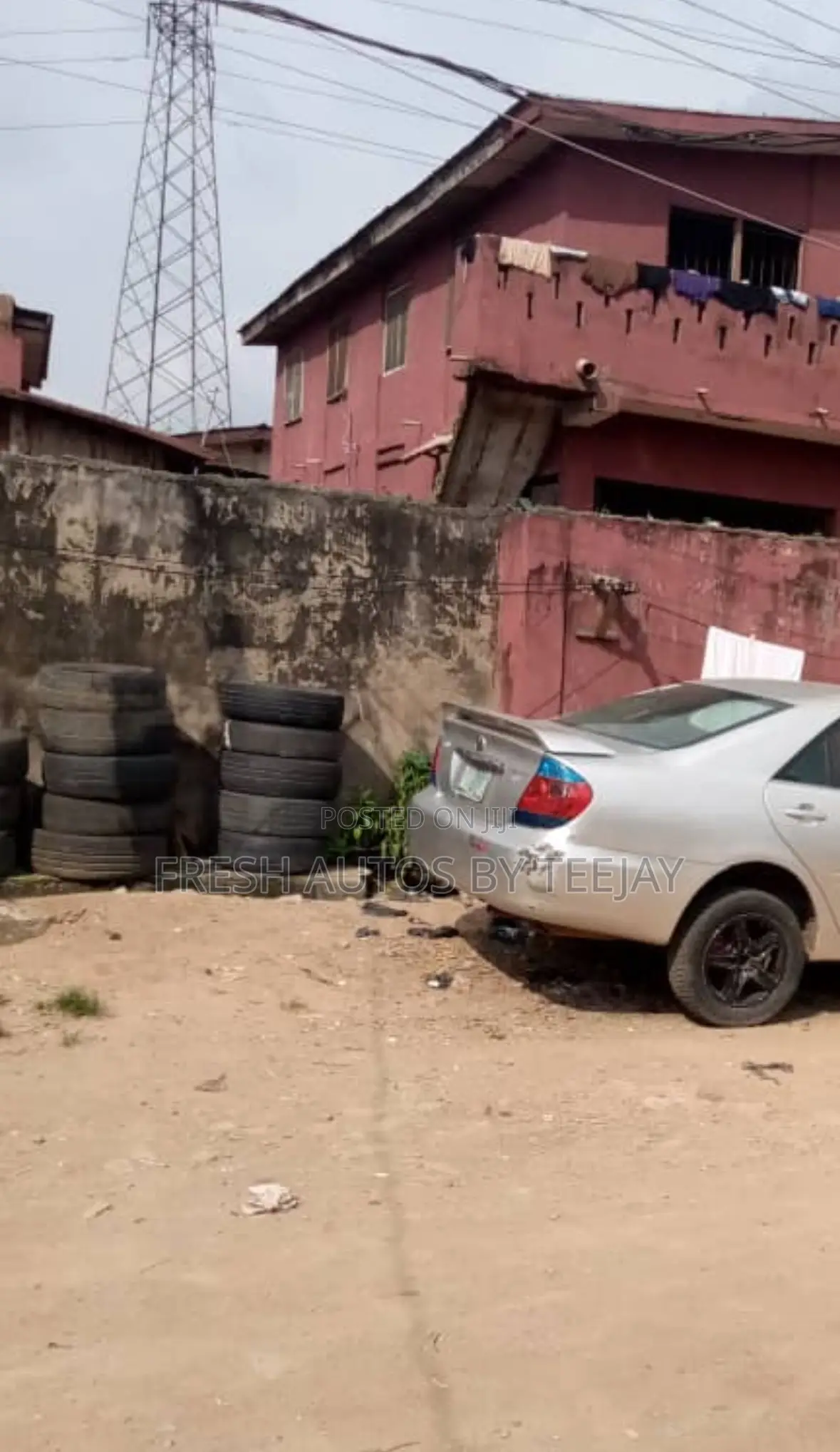 A Land With Old Storey Building in Magodo for Urgent Sale.