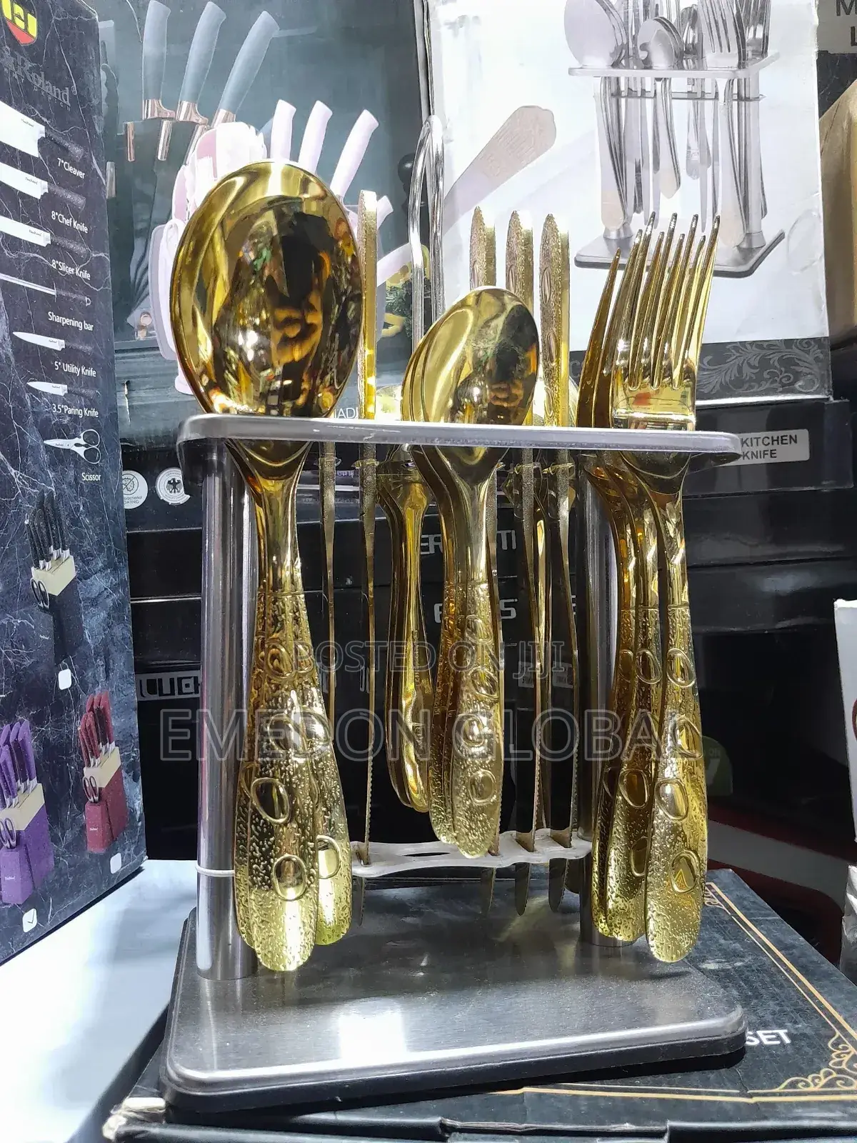 A Set of Gold-Finished Stainless Steel Cutlery.