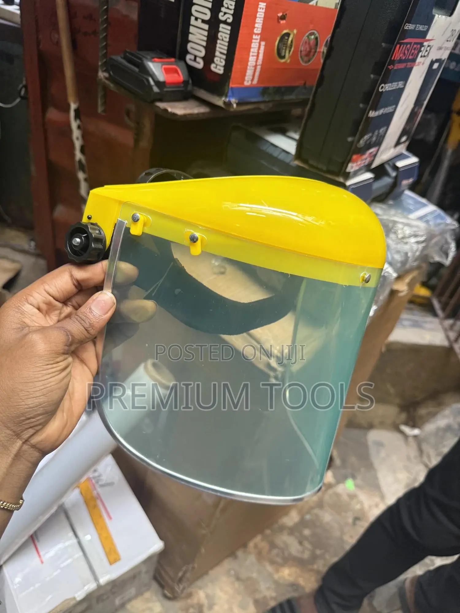 Re-usable Safety Face Shield With A Yellow Headgear.