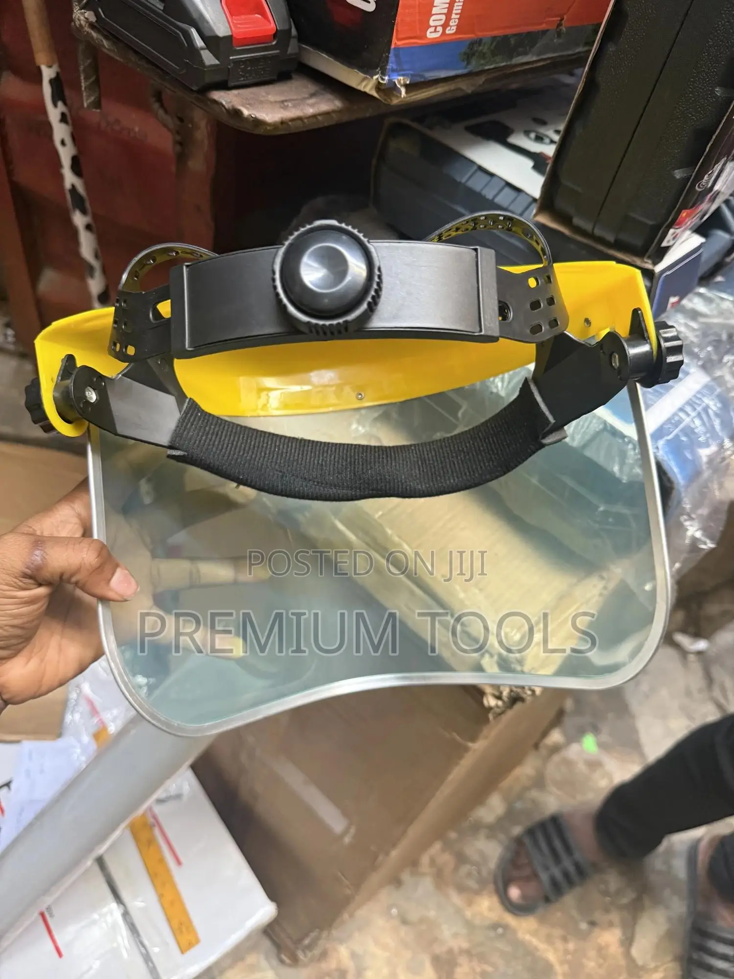Re-usable Safety Face Shield With A Yellow Headgear.