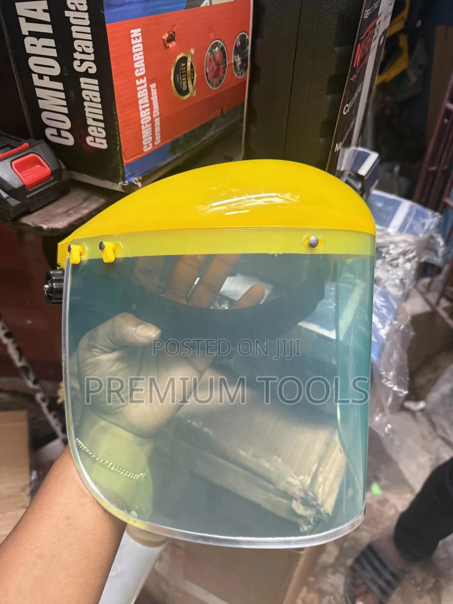 Re-usable Safety Face Shield With A Yellow Headgear.