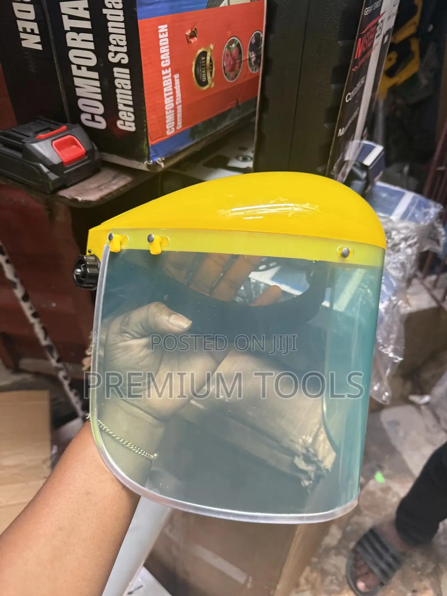 Re-usable Safety Face Shield With A Yellow Headgear.