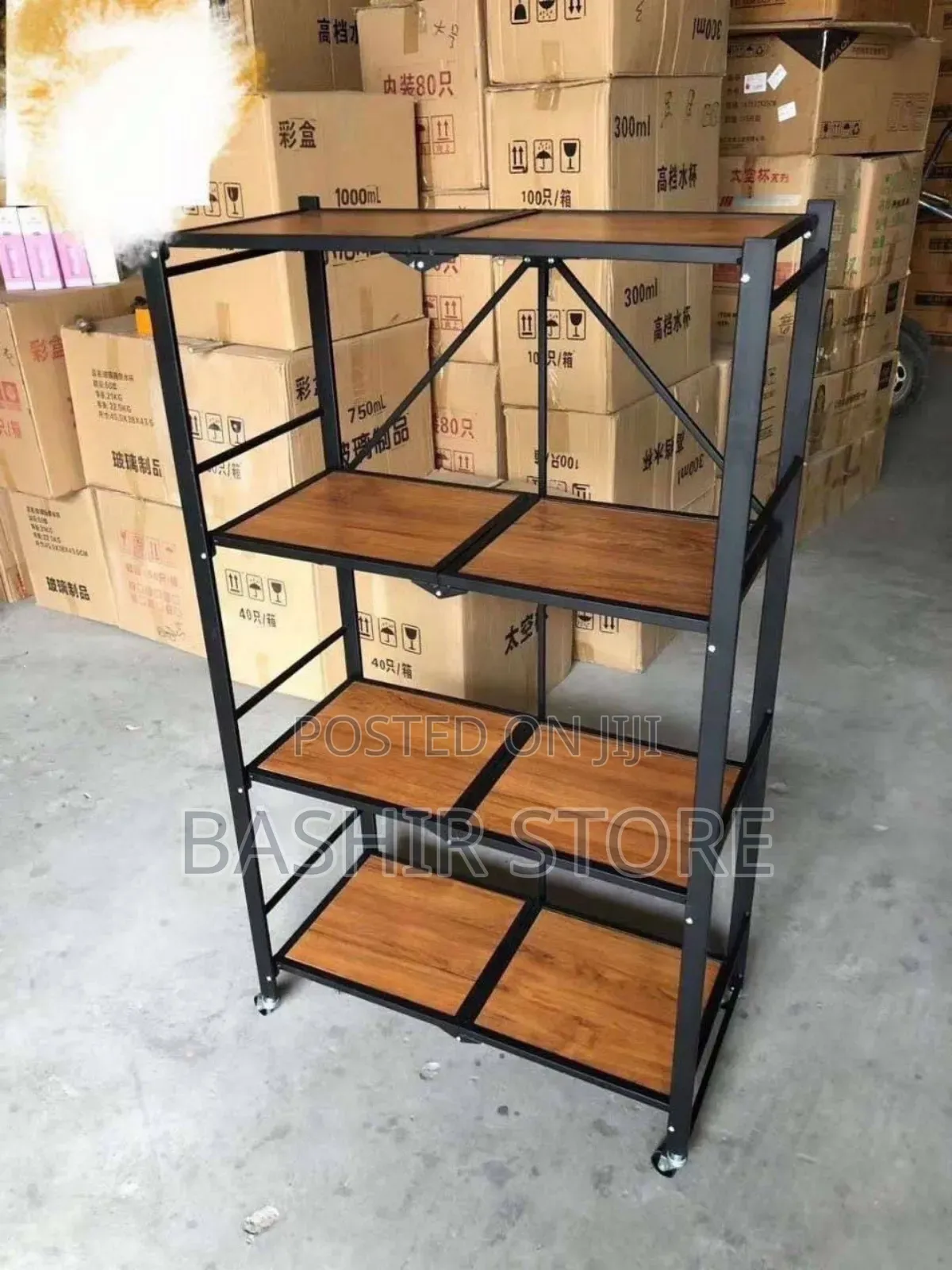 Four-Layer Foldable Metal Storage Rack With a Wood-Look Top Shelf.