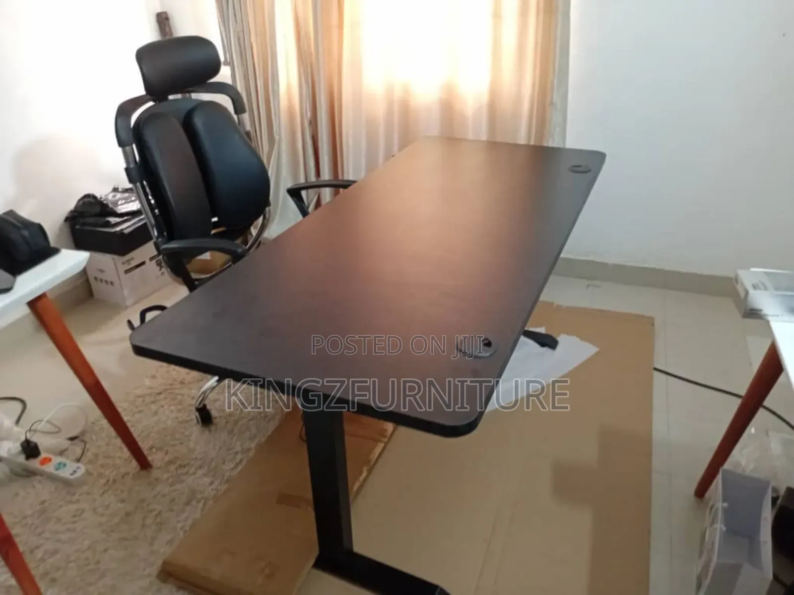 Electric Height-Adjustable Desk and an Ergonomic Executive Chair.