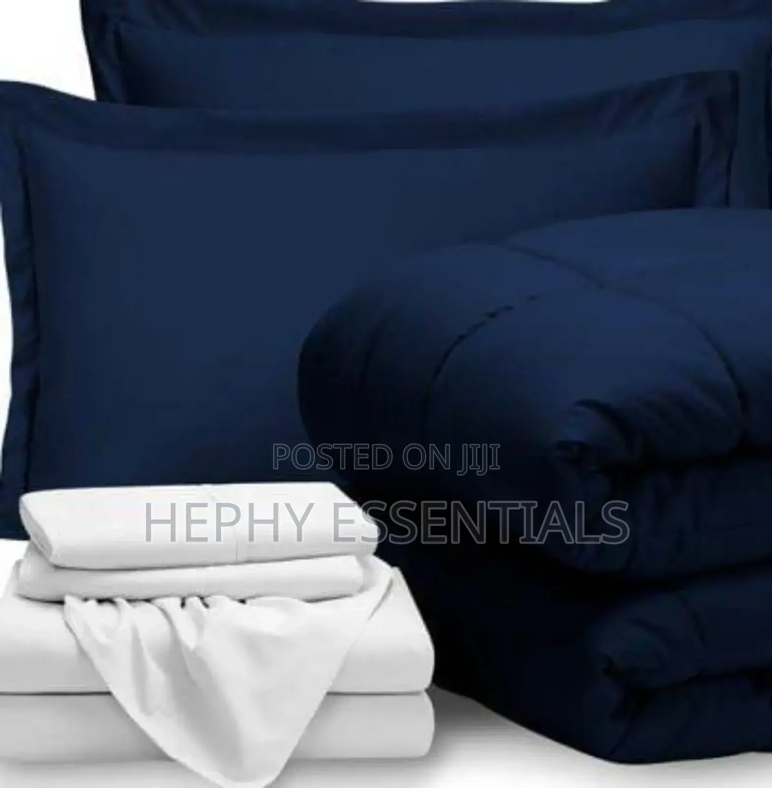Blue Duvet and White Bedsheets With Pillowcase
