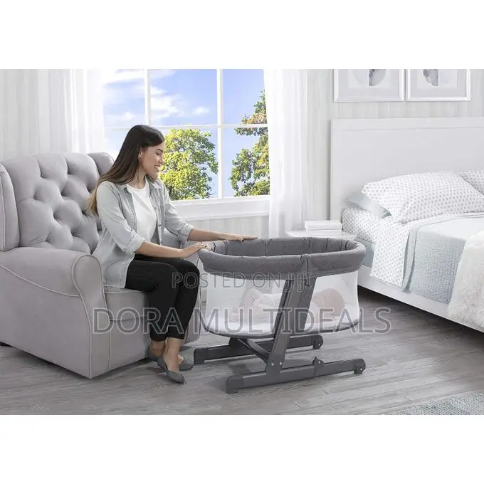 Delta Children Oval City Sleeper Bedside Bassinet Adjustable Height