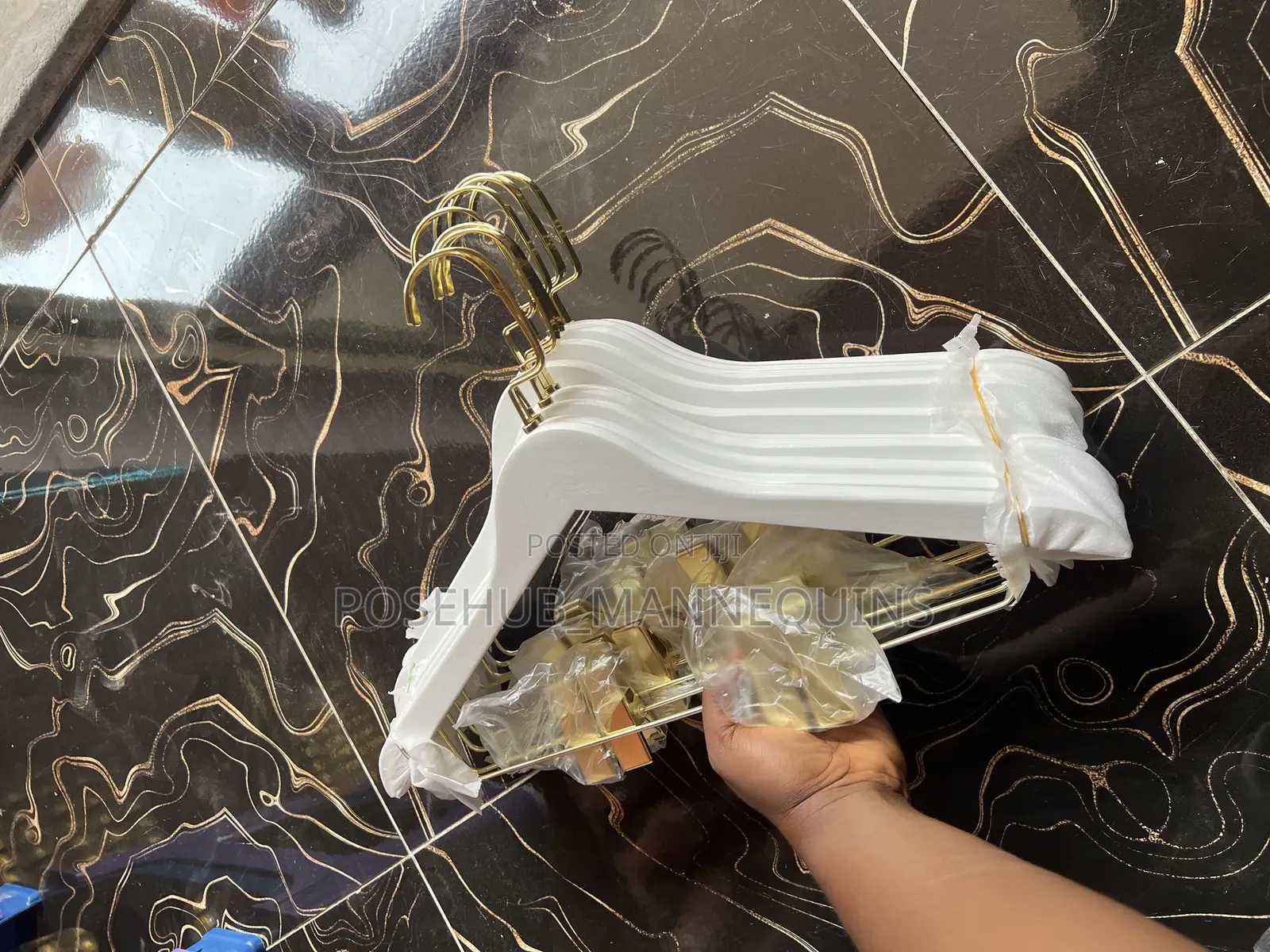 Gold and White Hanger With Clips