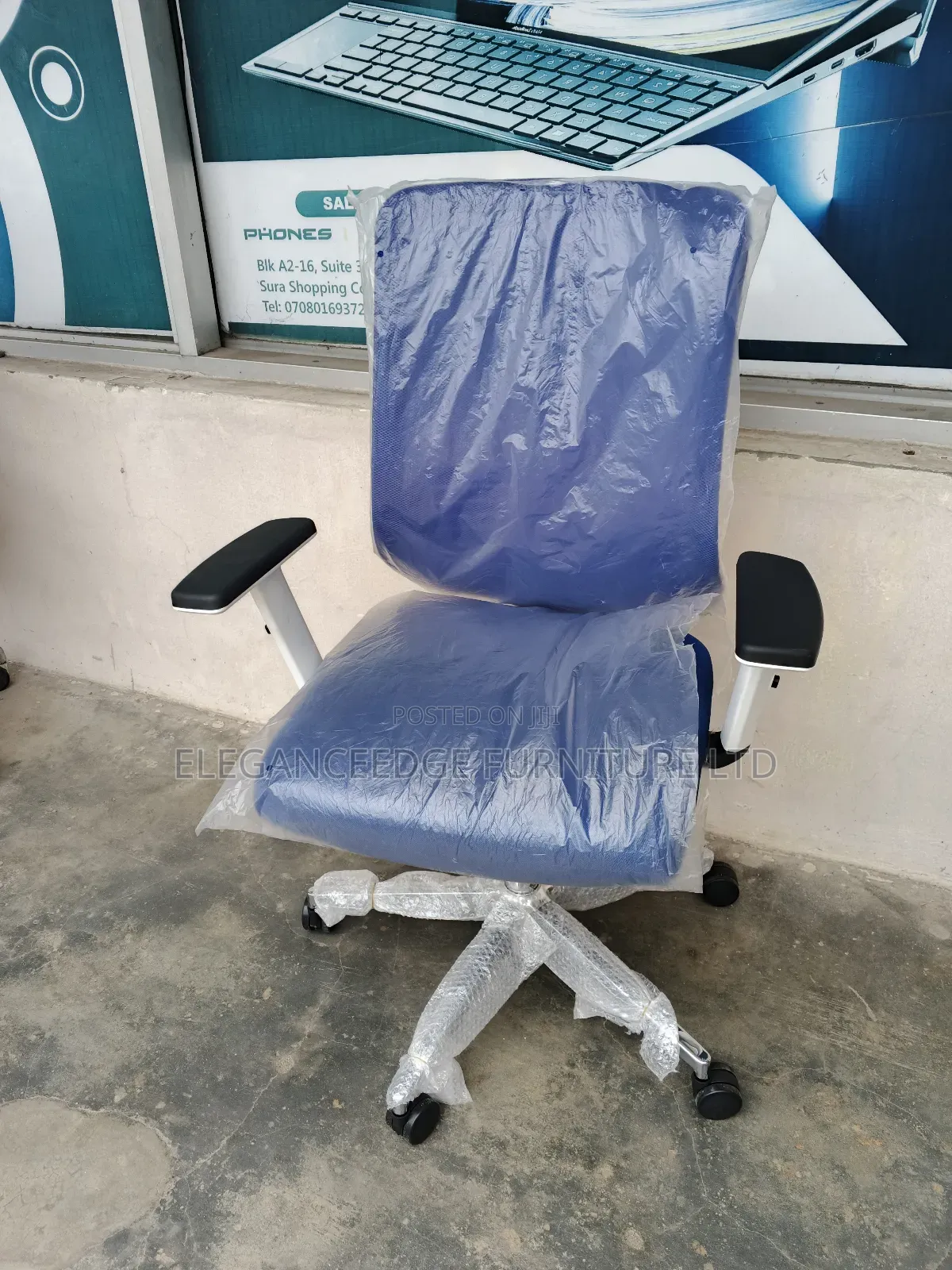 Blue Net Office Chair With Adjustable Arms and Recliner