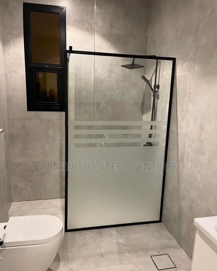 Frameless Glass Shower Enclosure With Stainless Steel Fittings 