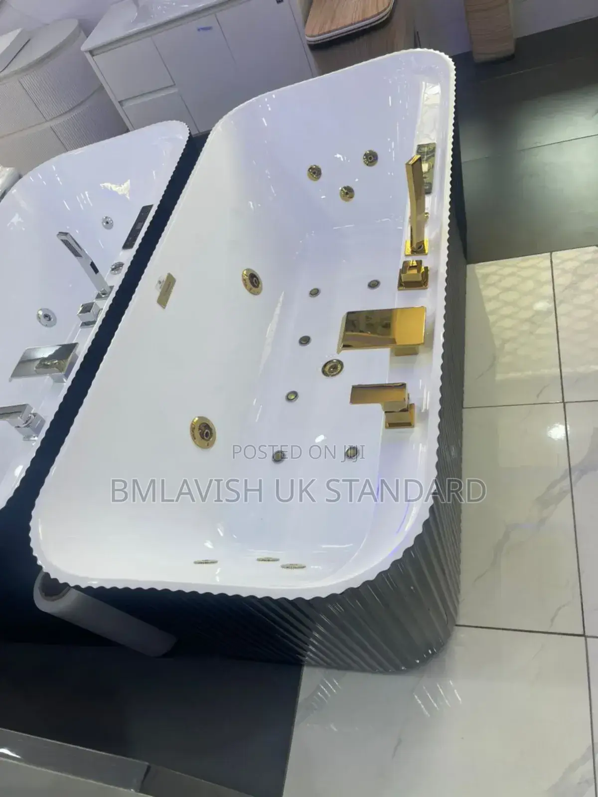 Black and White Luxury Single Jacuzzi With Gold Accessories