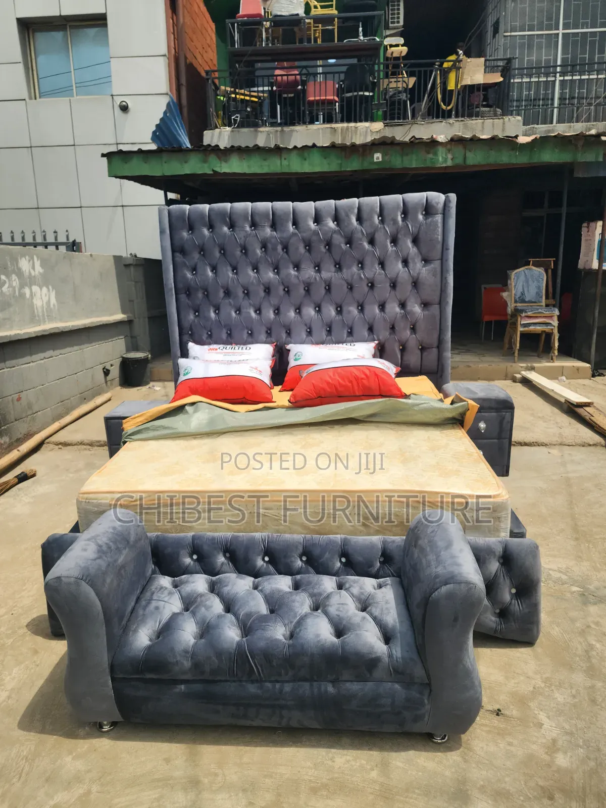 A 6by6 Upholstery Bed With Its Side Drawers and Footrest