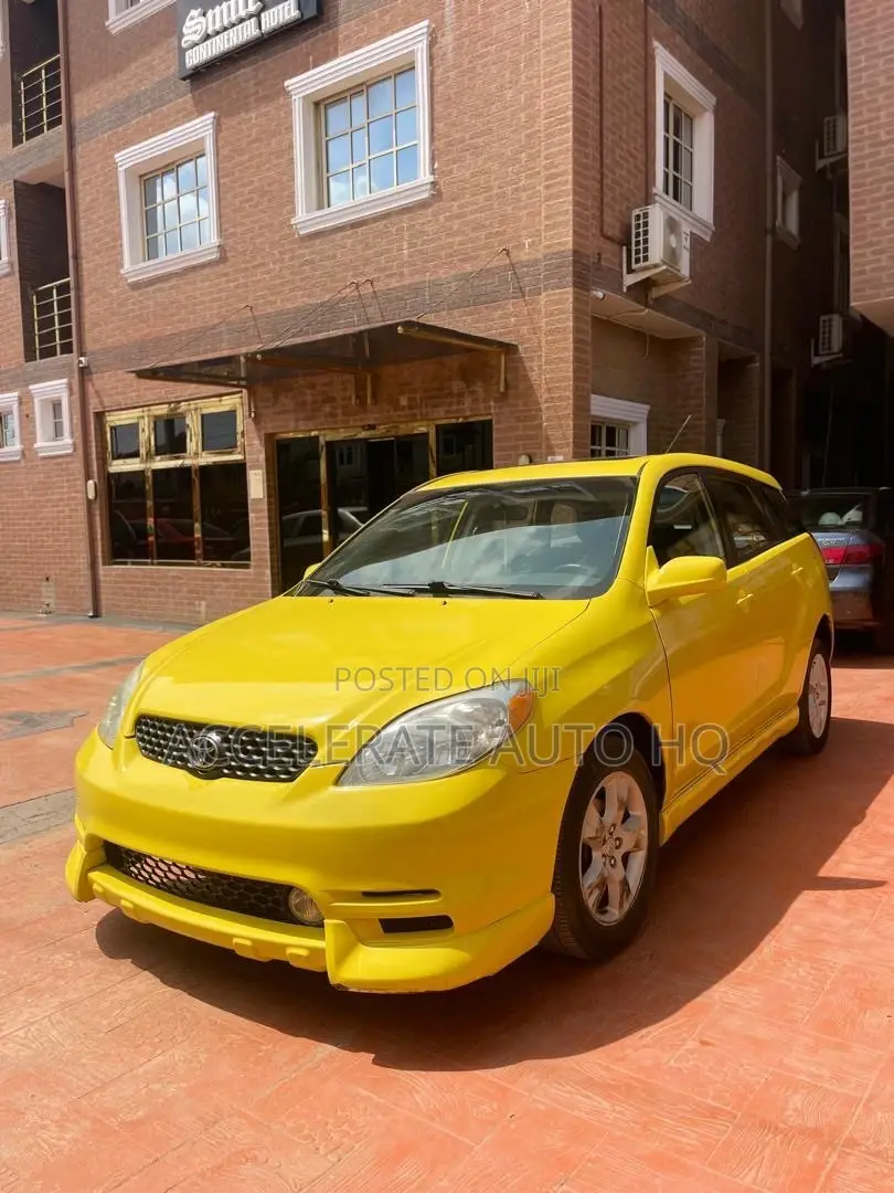Toyota Matrix XR Hatchback AWD (1.8L 4cyl 4A) 2004 Yellow