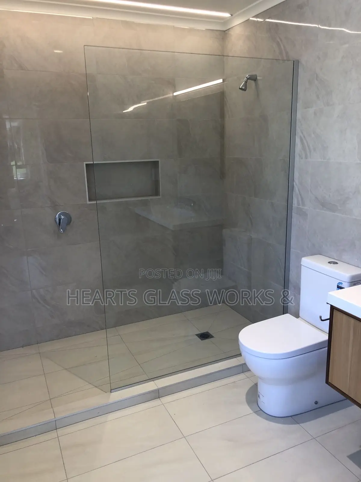 Open Up Your Bathroom Space With a Modern One-Sided Glass Enclosure.