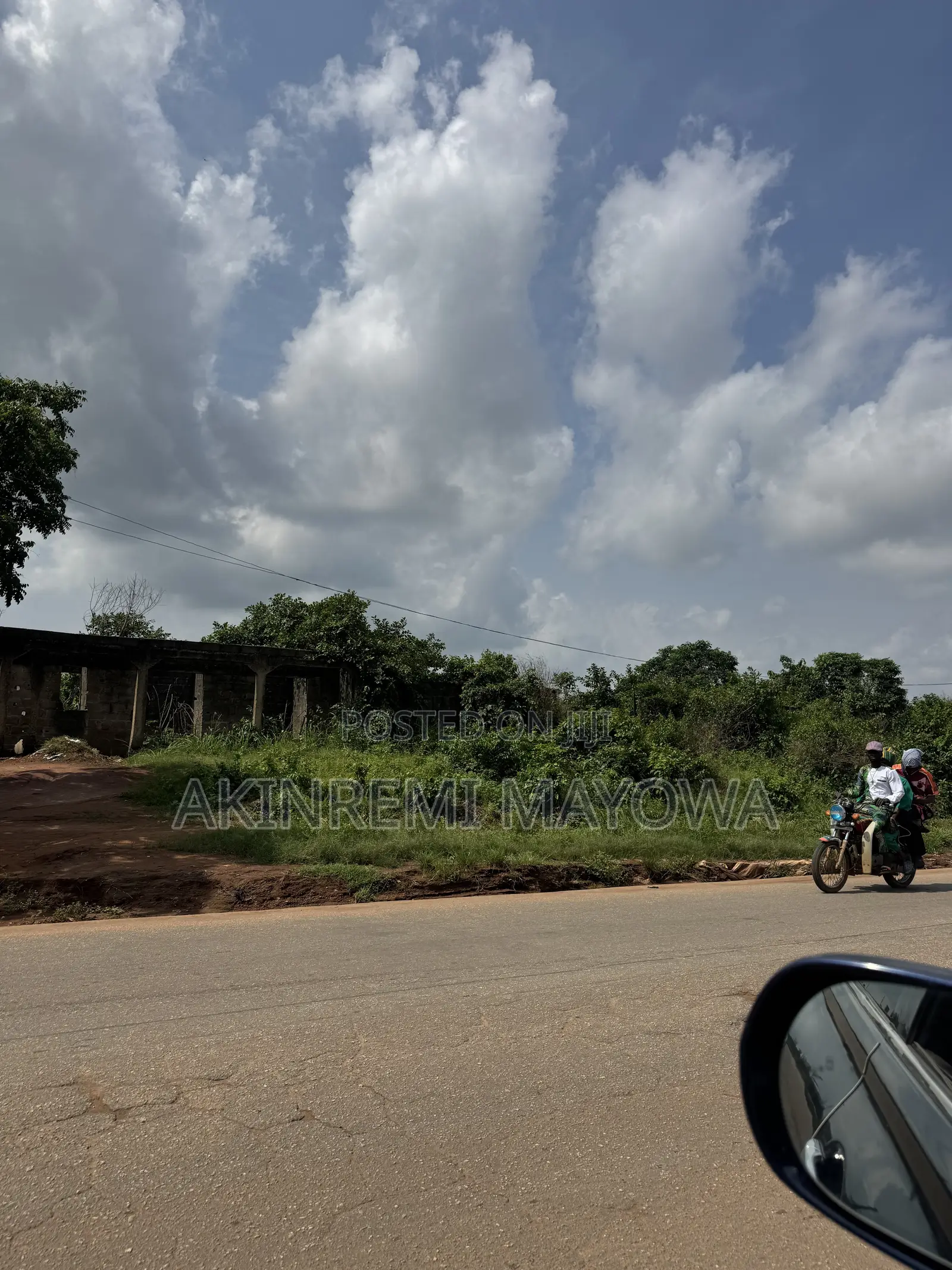 1 Acre of Land Fenceddirectly With 4 Shops