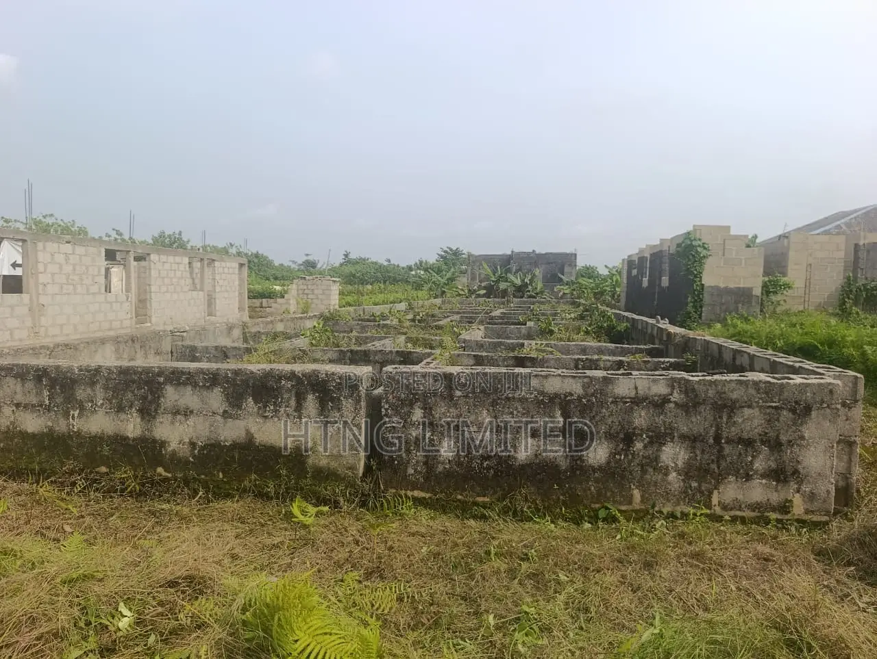 Half Plot of Land for Sale With Foundation on It