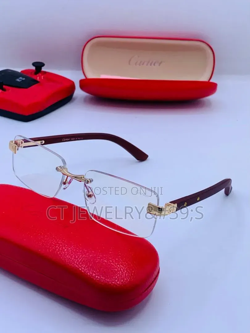 Cartier Rimless Distinctive Platinum Finish and Black Wooden Temples.