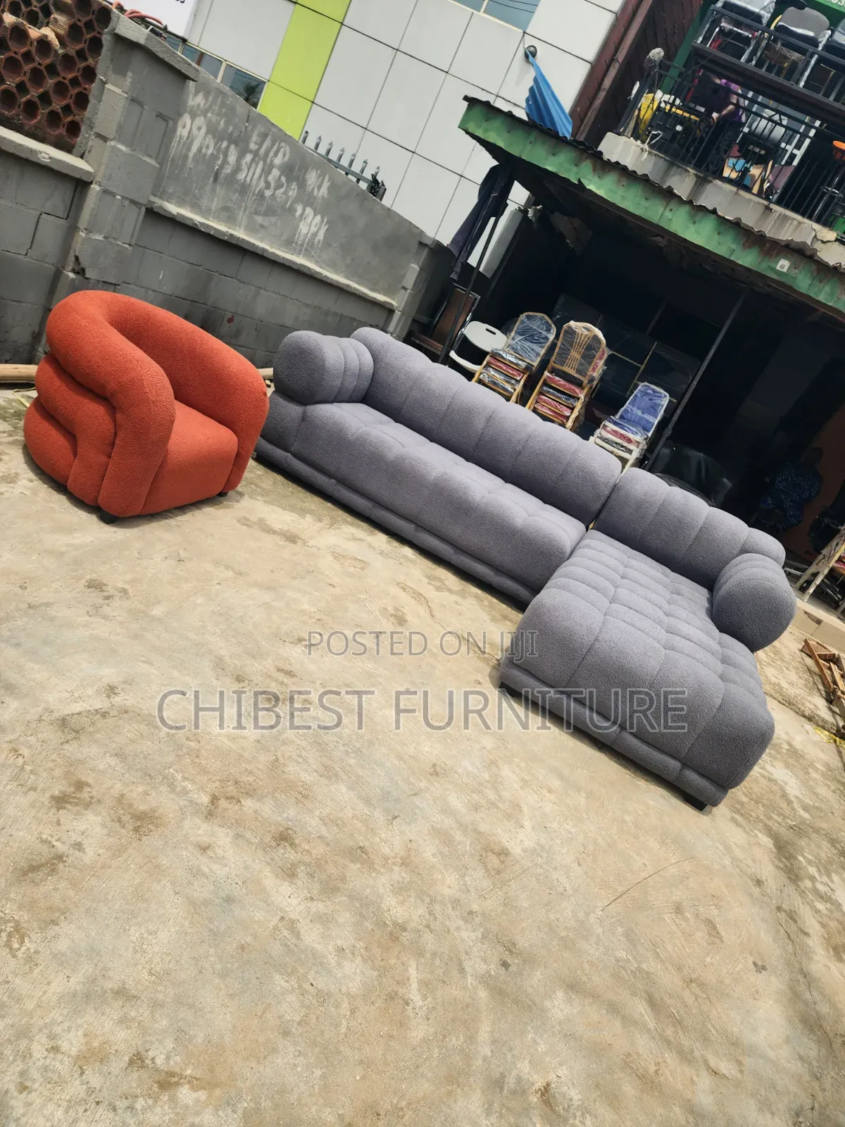 Executive Grey Upholstery Padded Sofa Chair With Its Single Seater.