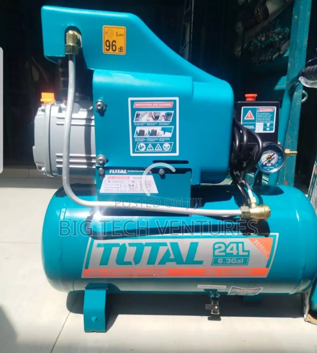 Total 24l Air Compressor Features a Turquois Tank With Clearly Labeled