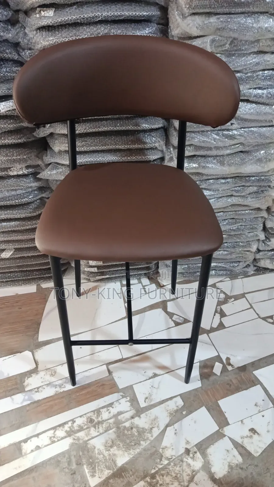 Modern Bar Stool Features a Brown Leatherette Padded Seat.