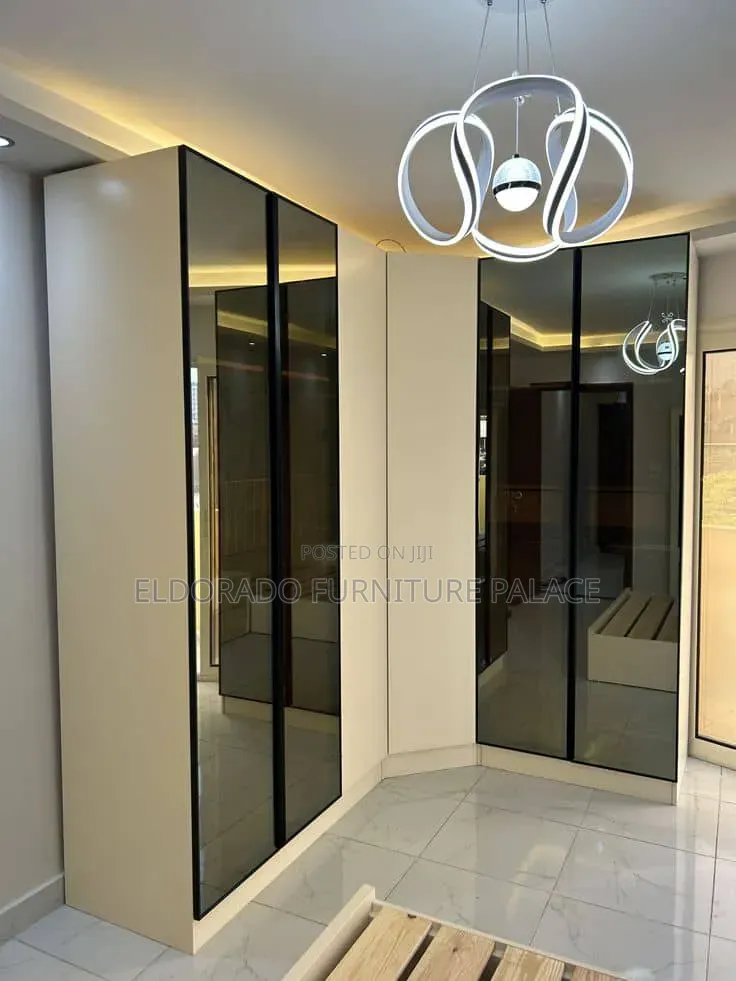 Master Bedroom Wardrobe With Frame Glass Doors and Lightings
